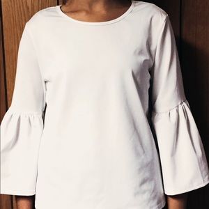 White shirt with flared sleeves